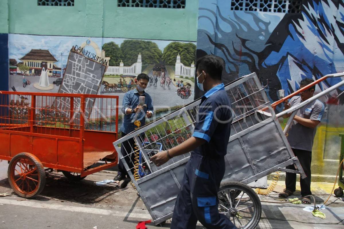 cara membersihkan gerobak sampah